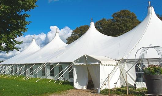 a line of sleek and modern portable restrooms ready for use at an upscale corporate event in Brookline MA